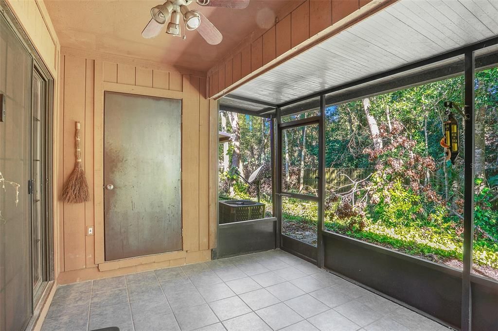 Screened porch backing up to nature.