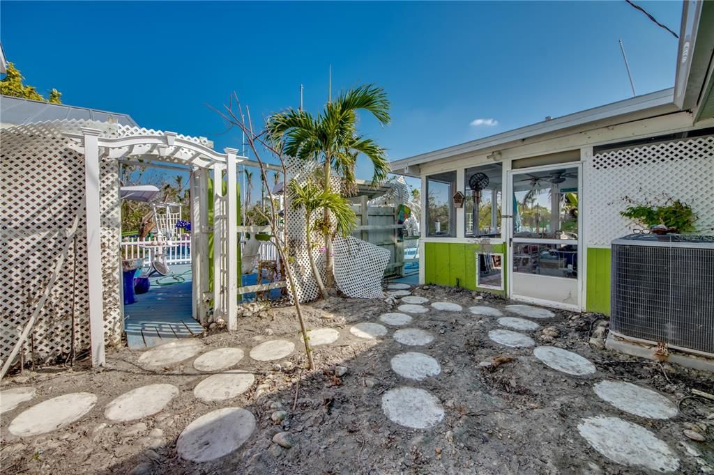 View of patio / terrace with a sunroom and central air condition unit