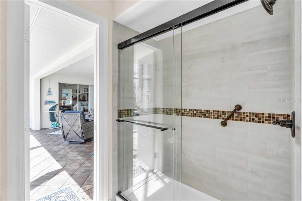 a brand new tile walk-in shower your sure to enjoy after the pool.