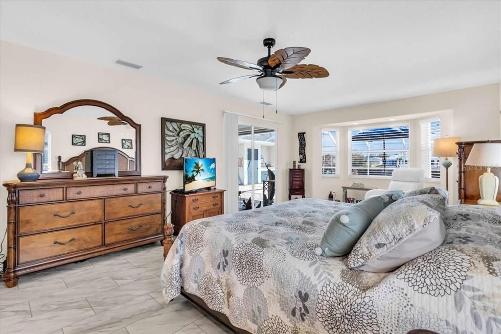 master bedroom has pool access and water view