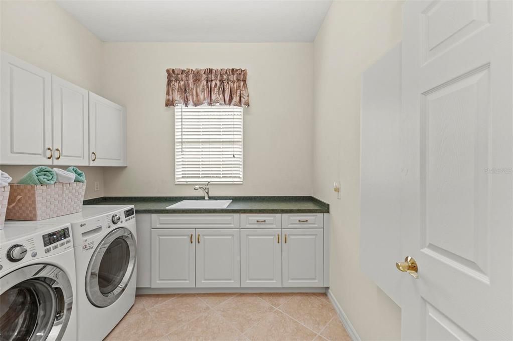 Laundry Room with electric and gas connections, Built-in Ironing Board