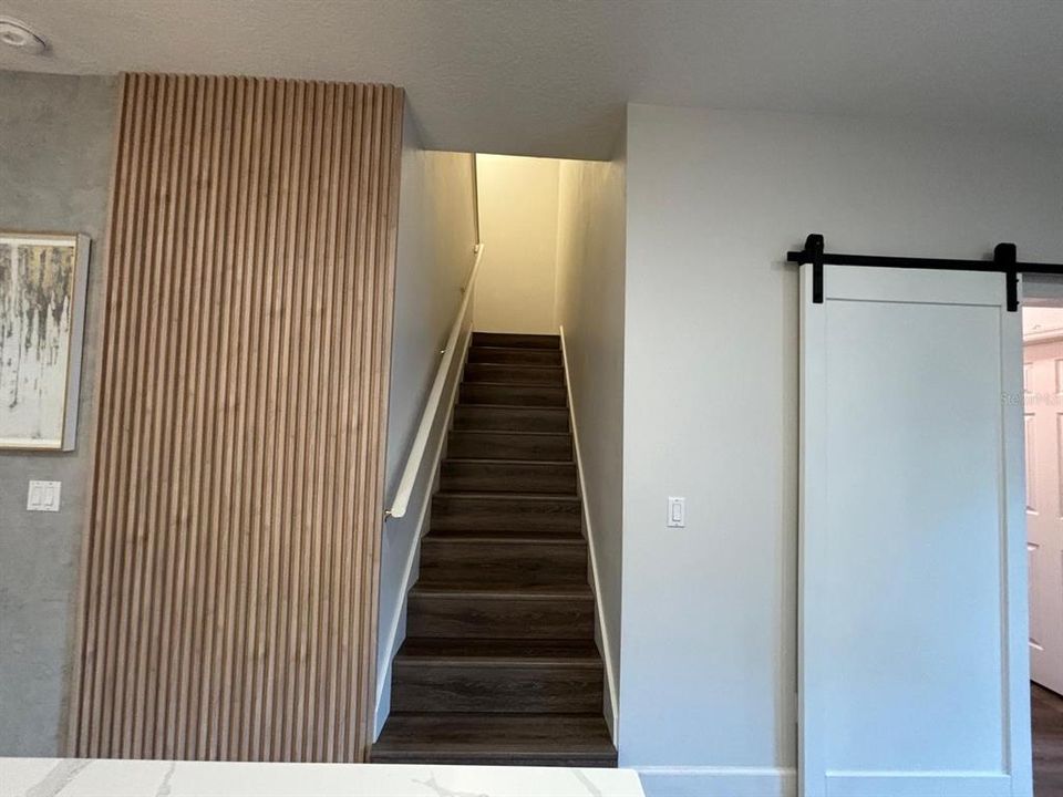 Stairway with laminate floors and wall enhancements