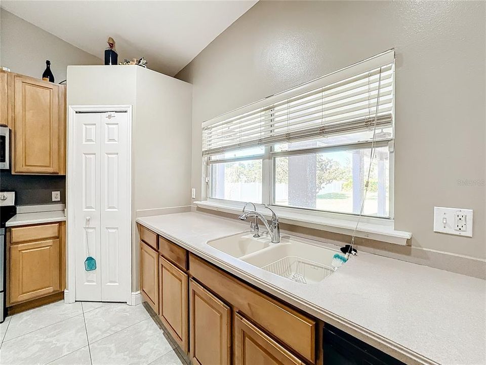 Kitchen Sink/ Counter Space with view of Back yard