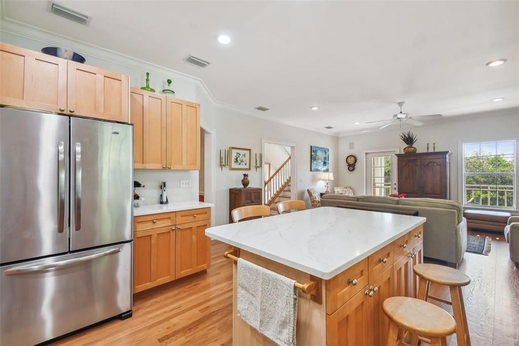 From the Kitchen you can see the bright Family Room from a window and a door to the large enclosed porch.