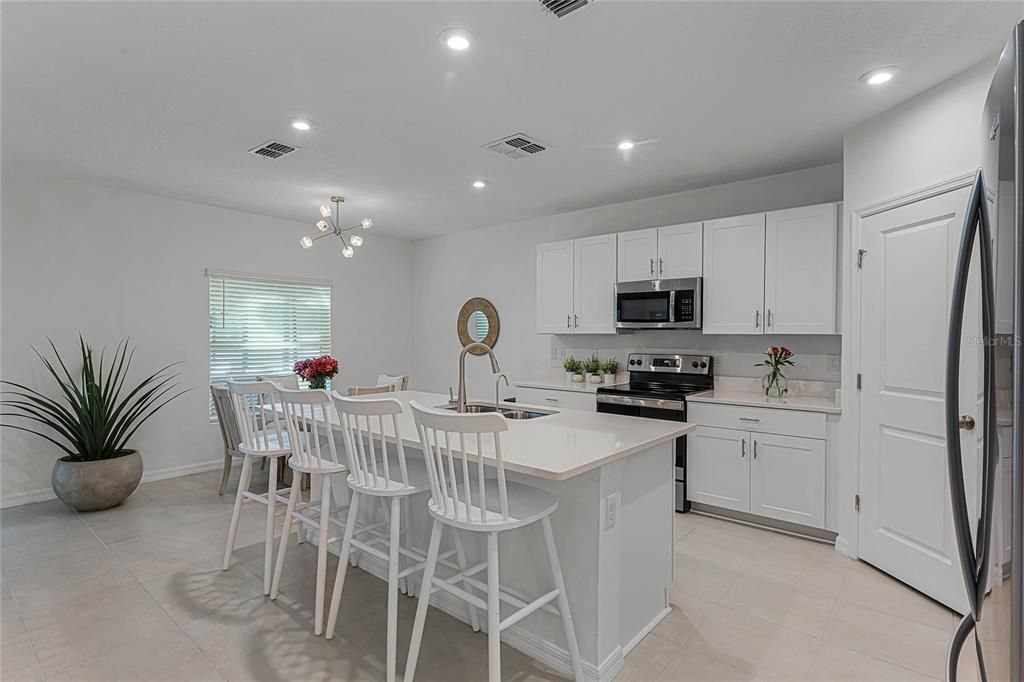 Chef's Kitchen with Refrigerator, Dishwasher, New Microwave, and Closet Pantry.