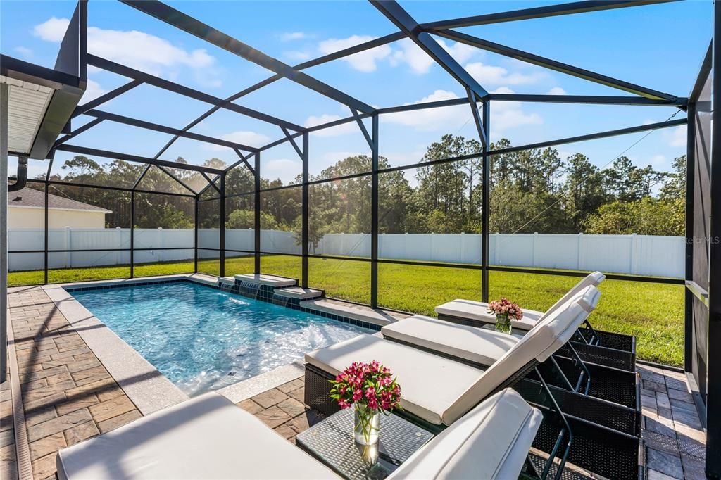 Luxury Pool with Jets, beachfront entrance, and sitting ledge by the jets.