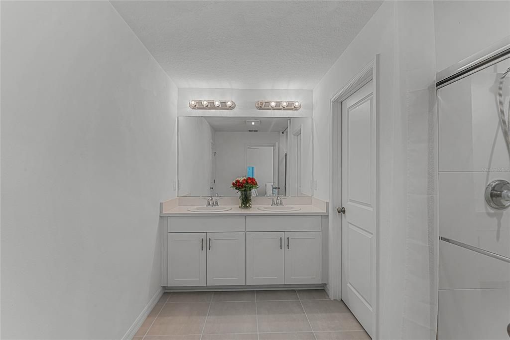 2nd Floor Master bathroom, with dual sinks, shower, and separate toielet.