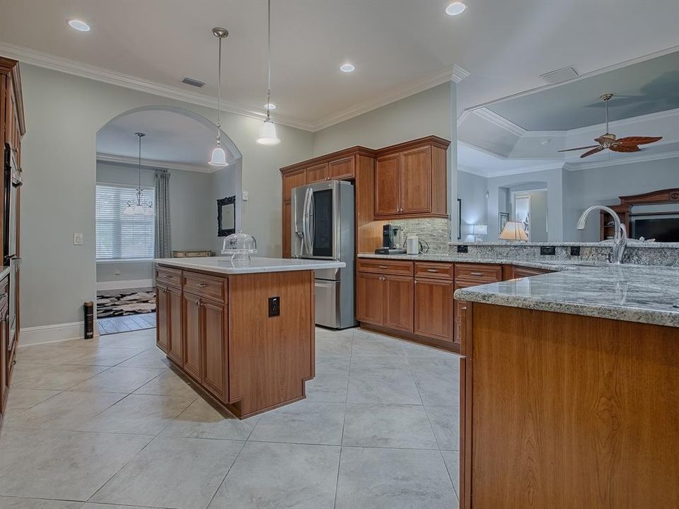 PLENTY OF ROOM IN THIS KITCHEN! LIGHT AND BRIGHT WITH RECESSED LIGHTING AND A SOLAR TUBE FOR NATURAL LIGHTING.