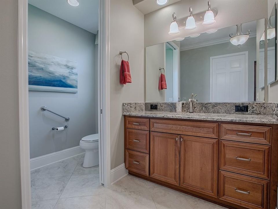 VANITY TO THE LEFT OF THE SHOWER. POCKET DOOR LEADS TO THE PRIVATE TOILET ROOM.