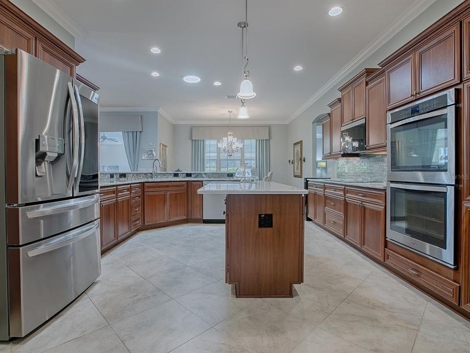 BEAUTIFUL KITCHEN WITH CHERRY CABINETRY AND GRANITE COUNTERTOPS.