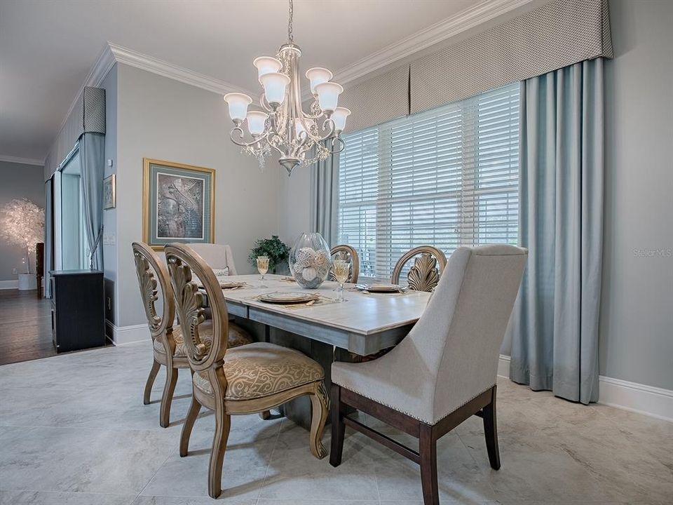 DINING ROOM OFF THE KITCHEN - IF YOU USE THE STUDY FOR FORMAL DINING, THIS IS A GREAT ROOM FOR YOUR CASUAL DINING.  VERY VERSATILE ROOMS. CUSTOM DRAPERY AND FIXTURES THROUGHOUT.