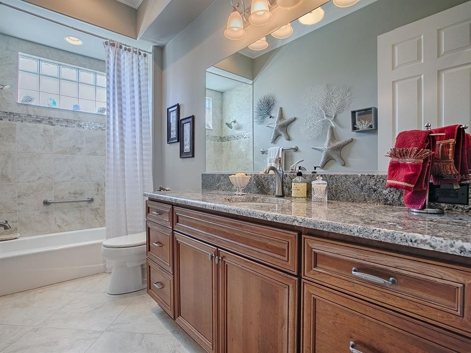 GUEST BATH WITH GRANITE COUNTERS, TUB/SHOWER.