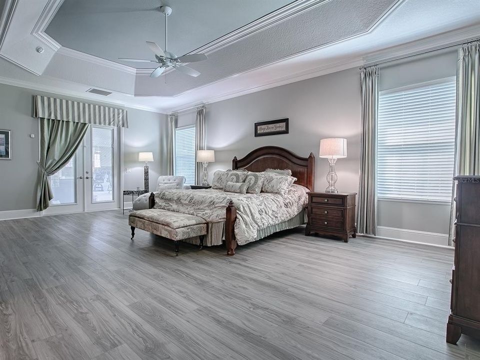 THE BEDROOM OPENS WITH FRENCH DOORS (WITH BUILT-IN BLINDS) OUT TO THE LANAI AND HOT TUB.