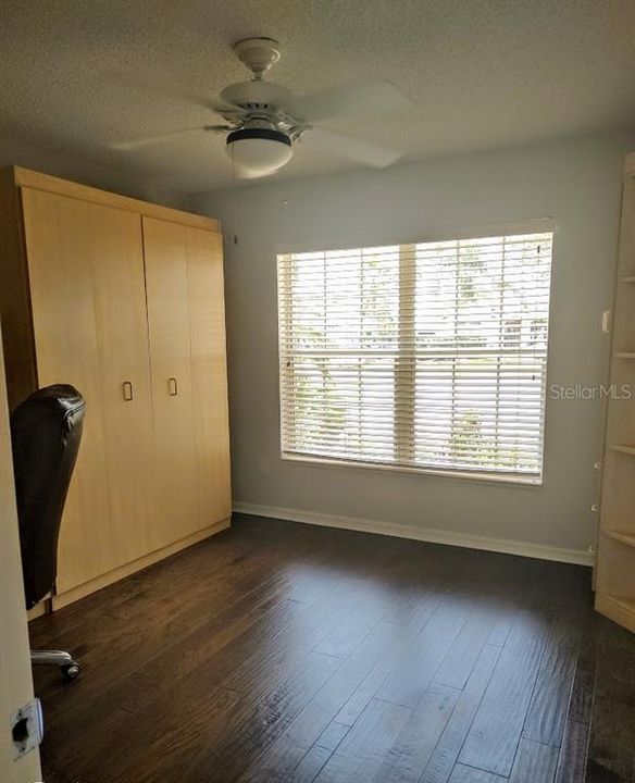 2nd bedroom with a murphy bed and built in desk