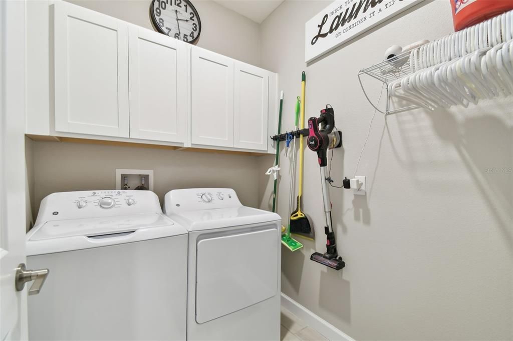 laundry room with cabinets