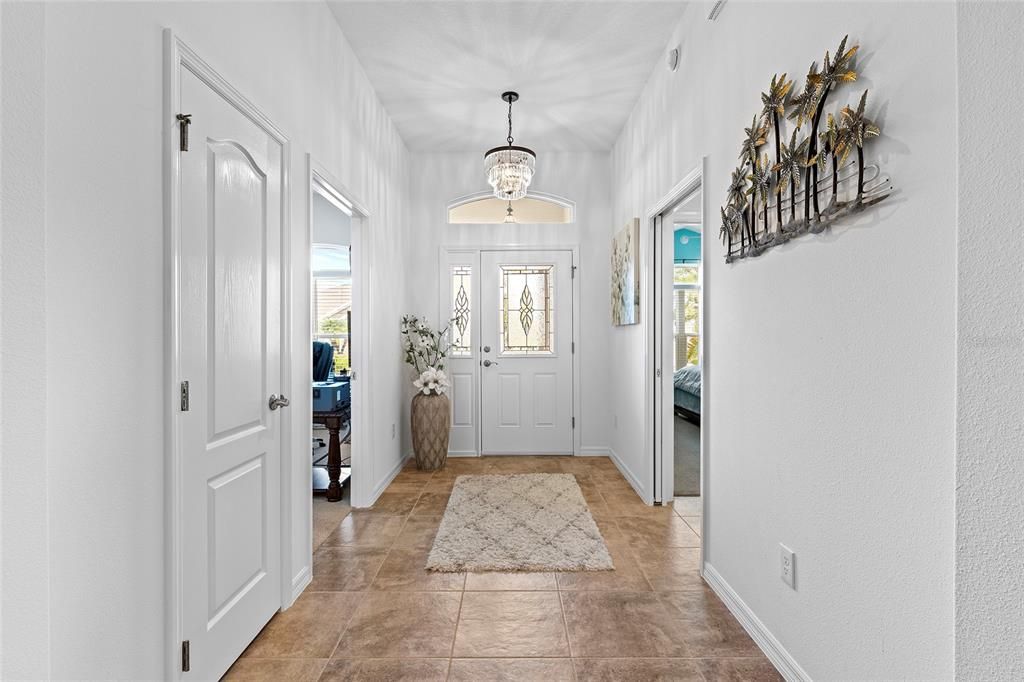 Looking toward entry, 3rd bedroom to left currently used as an office, 2nd bedroom and guest bath to right with pocket door for privacy