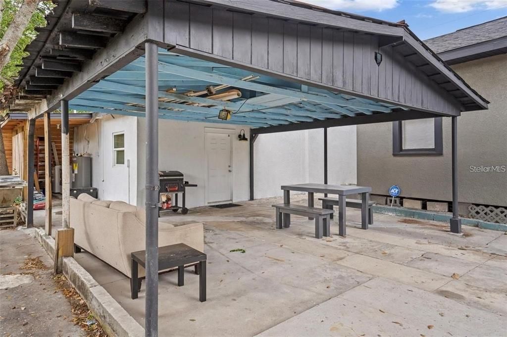 View of carport area/laundry area