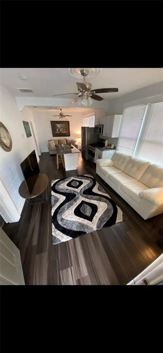 View of living room area and kitchen/breakfast bar and sitting area