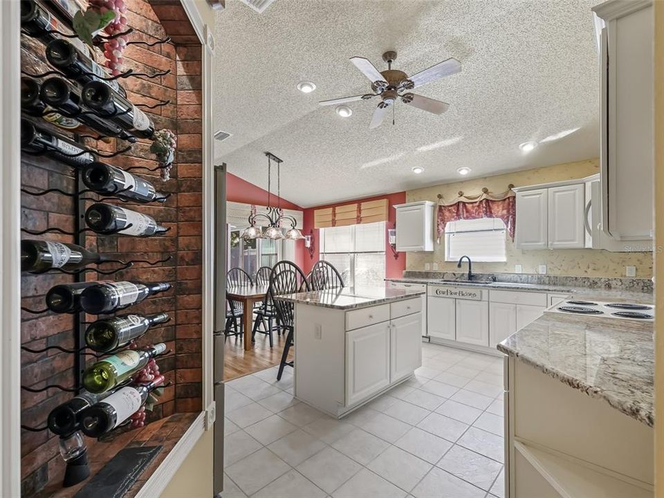 Looking from entry way into kitchen. Note the built -n lighted wine rack