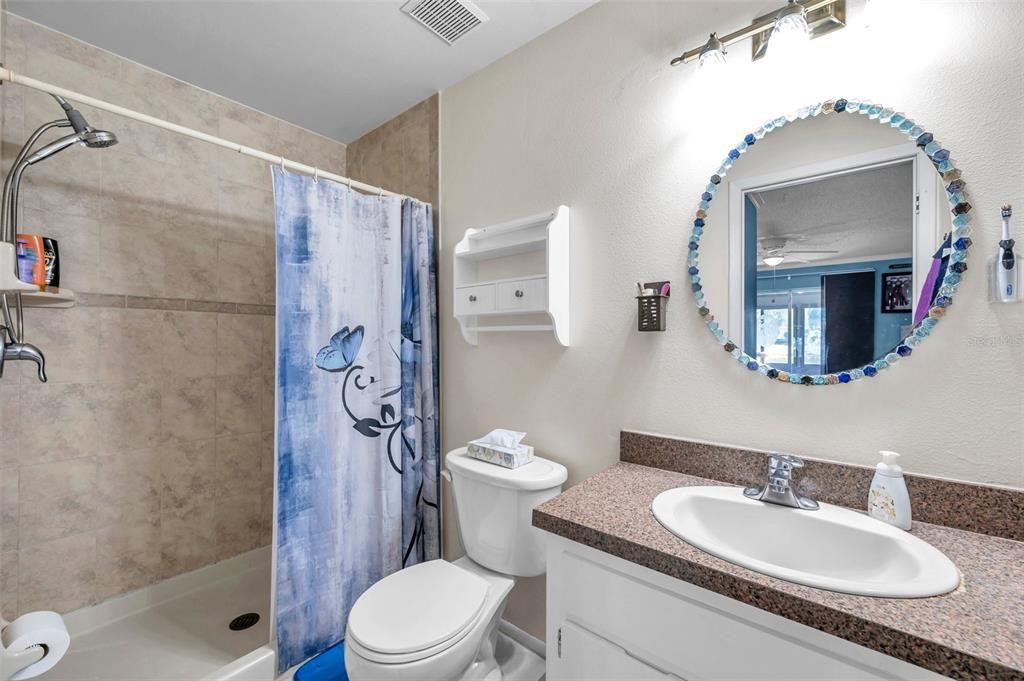 Master bathroom with nicely tiled shower