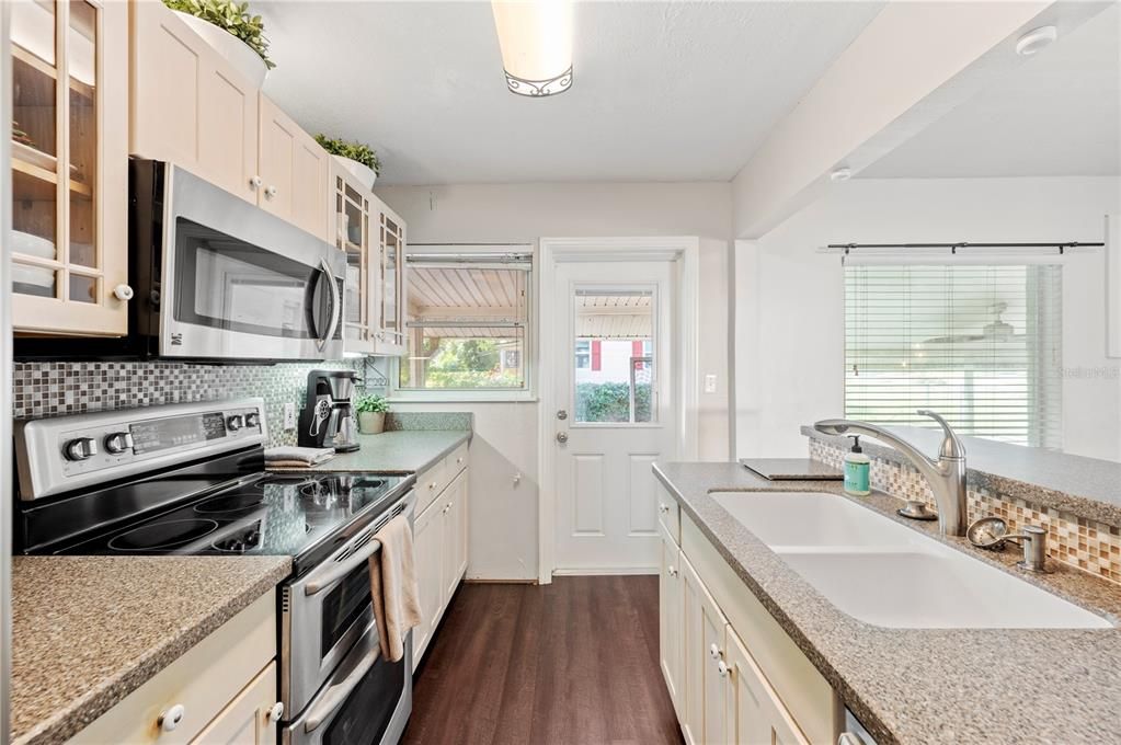 Kitchen with door to screened in back porch