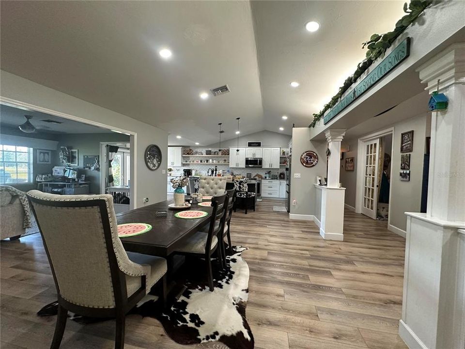 View of foyer, dining and kitchen - office to the right with French doors