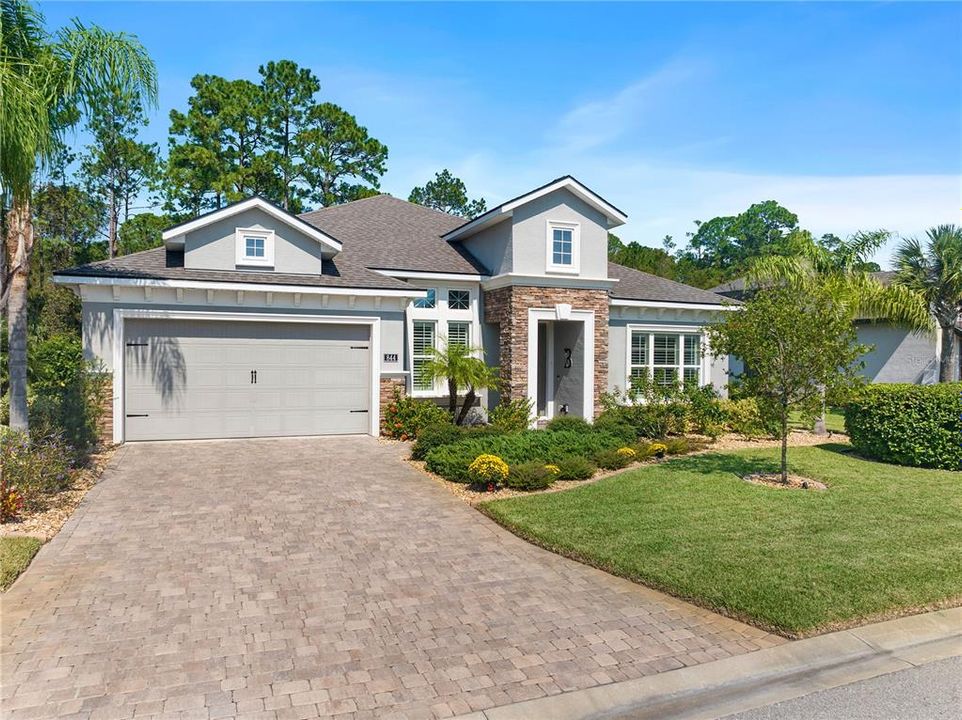 Pavers Driveway Leads to 3 Car Garage