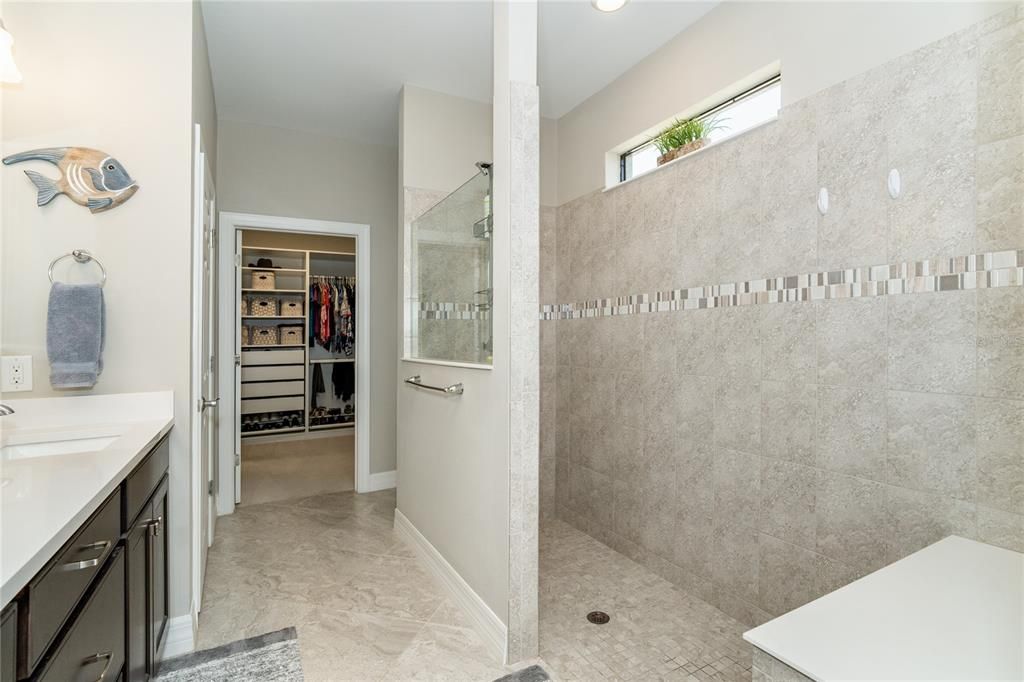 Primary Bathroom with Private Water Closet and Linen Closet and spacious Walk In Closet