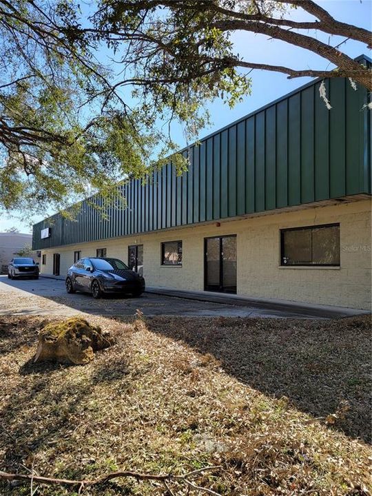 Front of building with 5 storefront entry doors