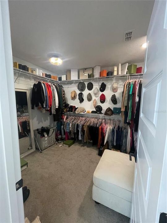 Oversized walk-in closet in master bedroom