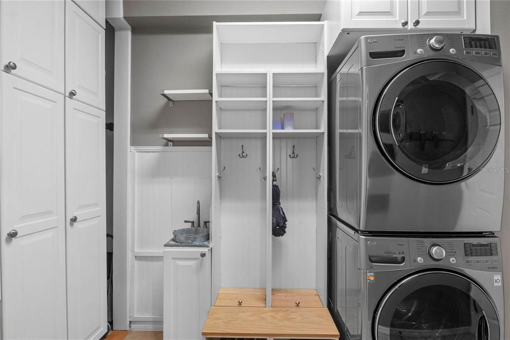 Huge Laundry room with lots of customized shelffing