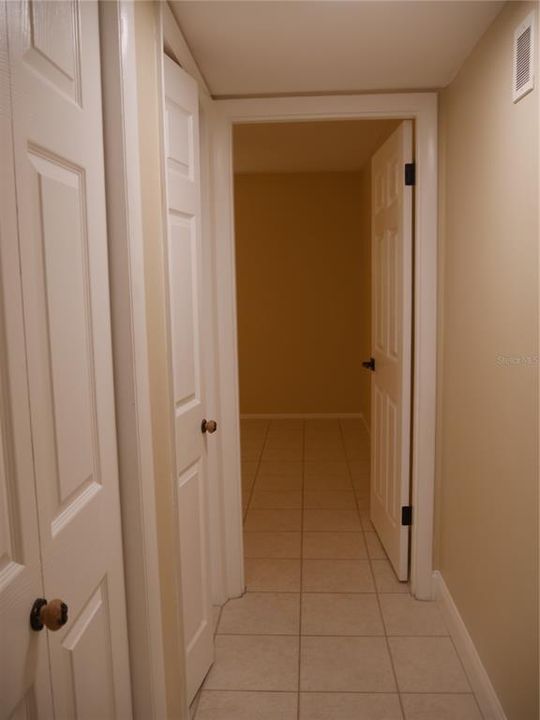 From hallway off great room looking into the Primary bedroom.  Plenty of storage in the hallway!