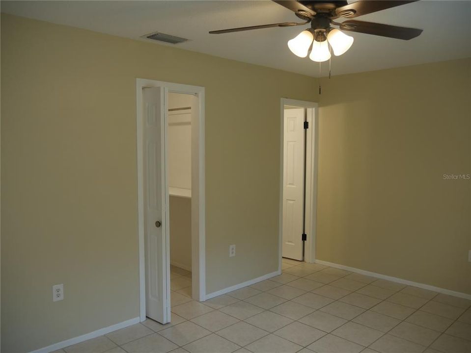 Walk-in closet is on left side and the door on the right is to the all new half-bath!  Large Primary bedroom!