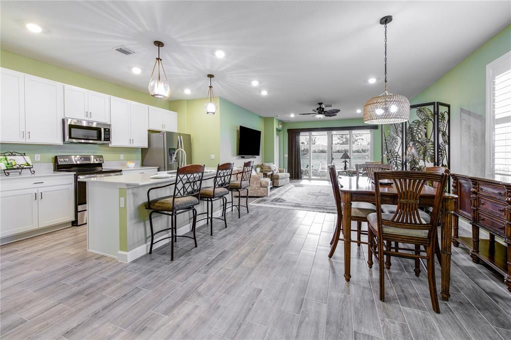 2024 Open Floor Plan, Fantastic for Entertaining. Upgraded with wood-look tile cohesive throughout the whole home. Enjoy the appearance of natural wood, while offering the durability and easy maintenance of tile.