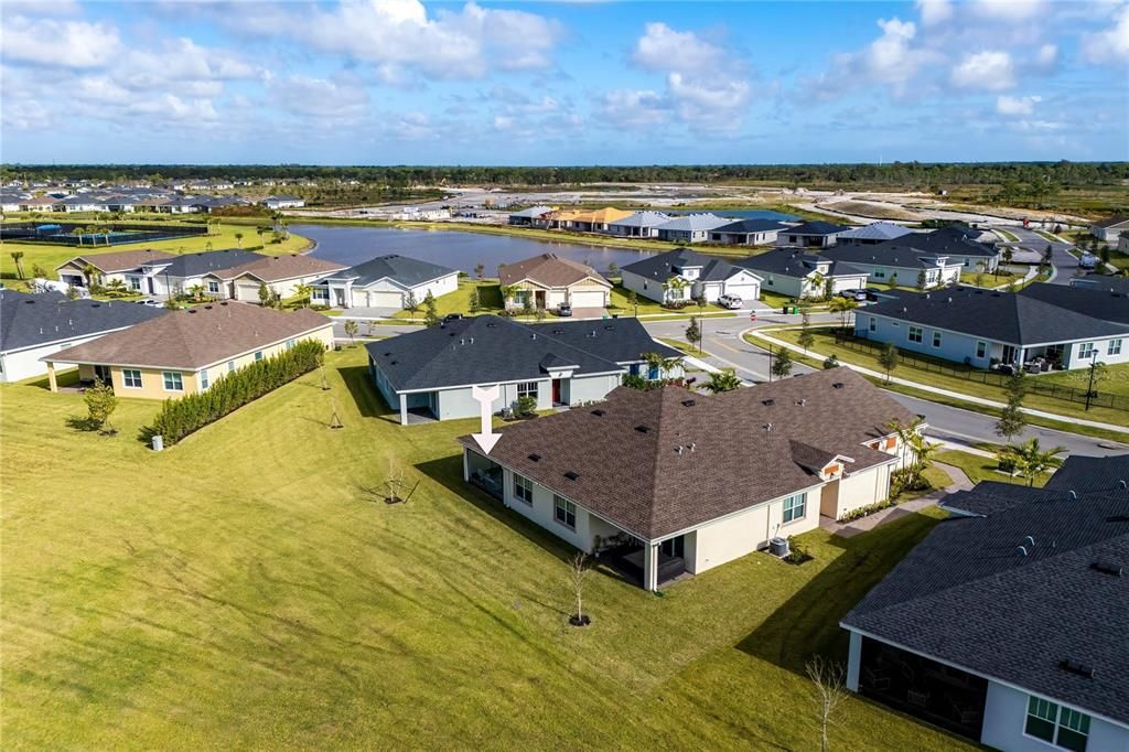 Aerial view of Back of home. Lawn manintained by HOA