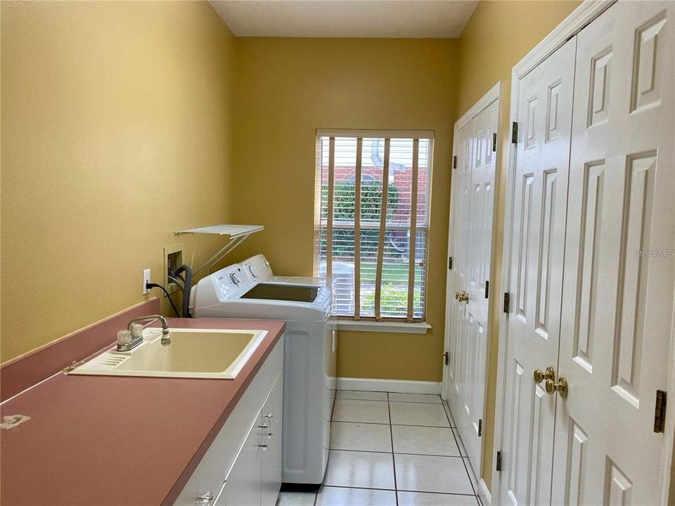 Laundry room with additional storage