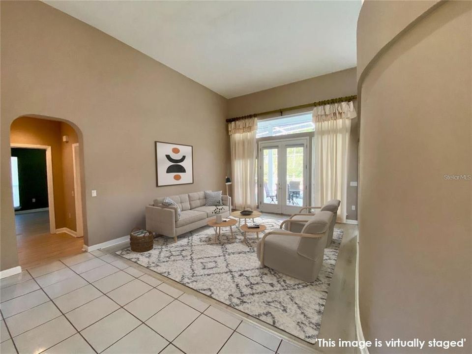 Living room, doors exit to screened pool