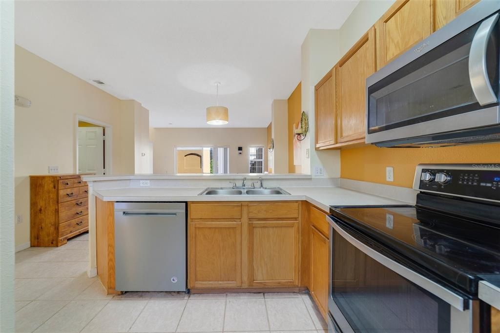 The kitchen is well equipped with plenty of cabinet and counter space, upgraded appliances and the breakfast bar gives you additional seating for casual dining or entertaining.