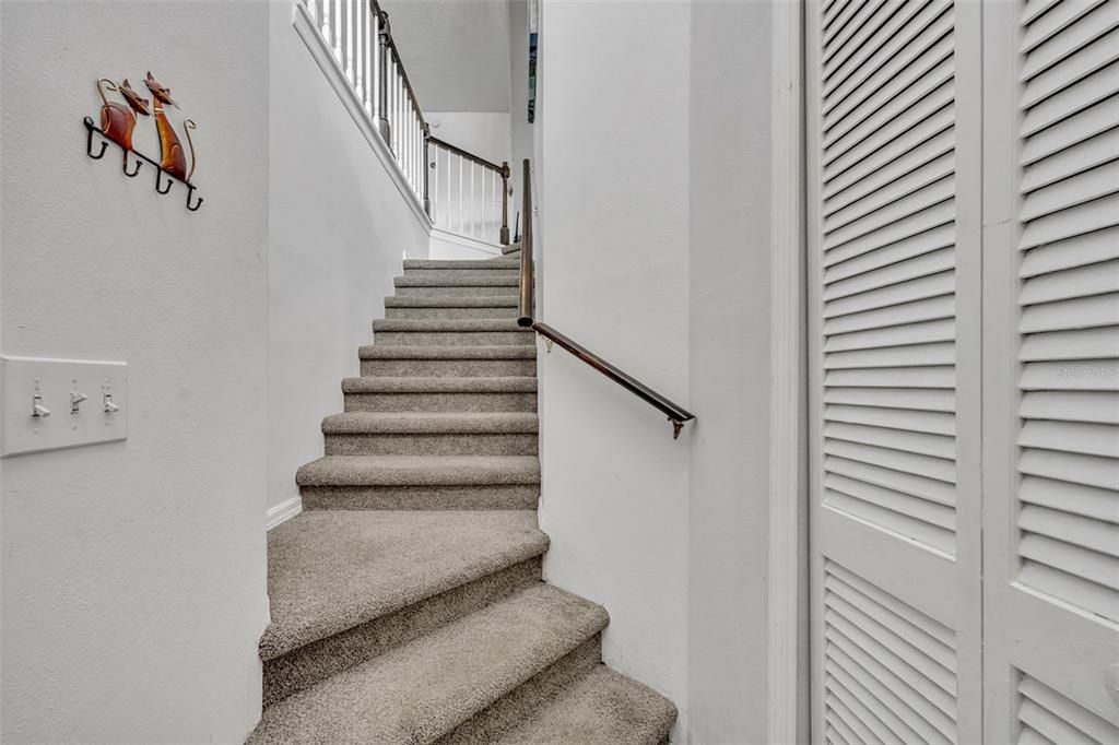 Stairs from front door, garage door to the left.