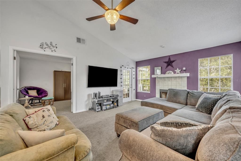 Living room with view of third bedroom.