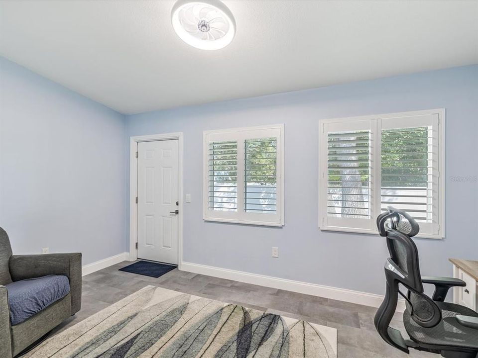 Bonus room with tile flooring and leads to the back yard