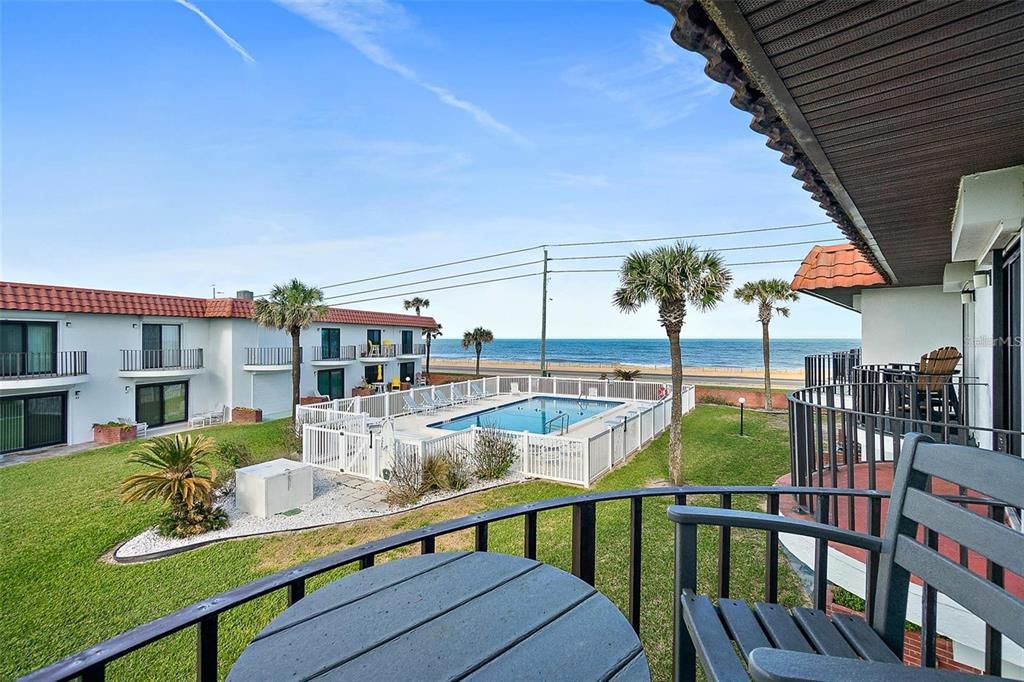 Ocean and pool view from balcony.