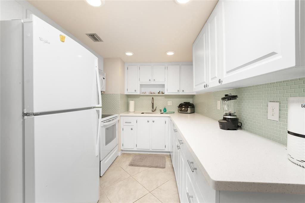 The kitchen and appliances are updated with ample cabinetry, as well.