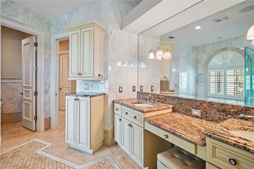 Primary Bath Vanities with Cabinets and Water Closet with Urinal