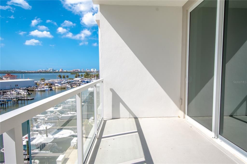 A large balcony with views of the marina and intercoastal waterway.