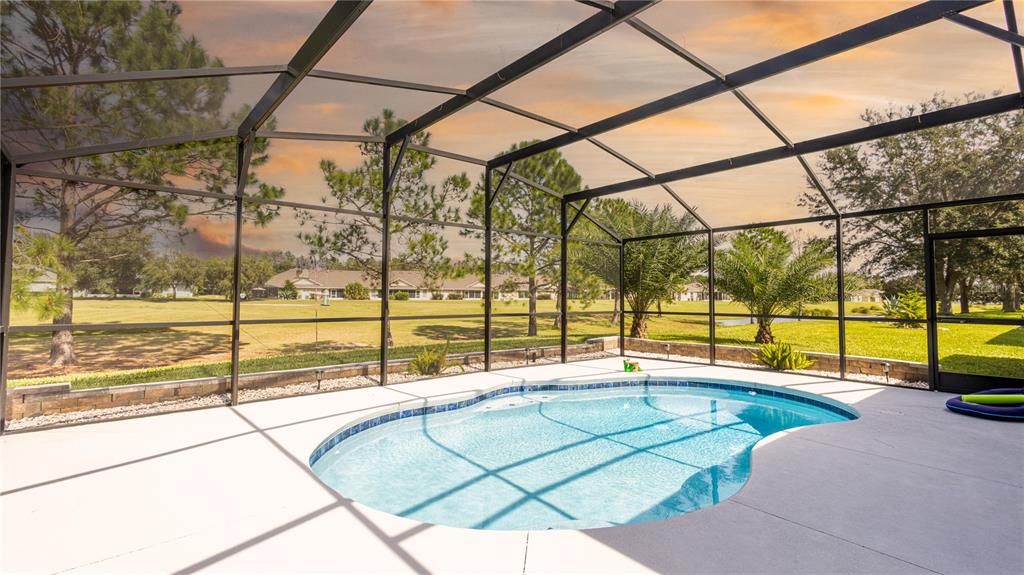 Screened-in pool overlooking the 10th hole