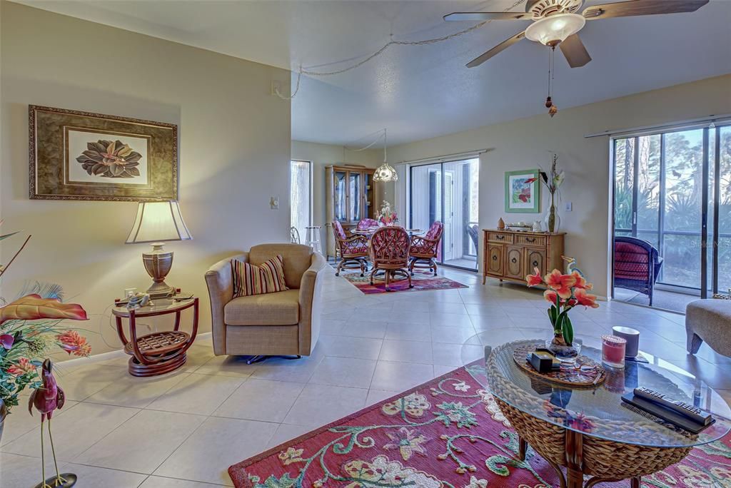 VIEW FROM LIVING ROOM INTO DINING SPACE. GREAT NATURAL LIGHT.