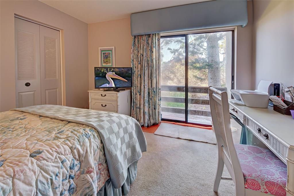 SECOND BEDROOM HAS SLIDERS FOR FRESH AIR AND GREAT NATURAL LIGHT.