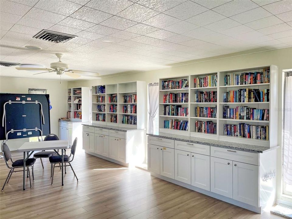 INTERIOR OF CLUBHOUSE & BOOK SELECTION.