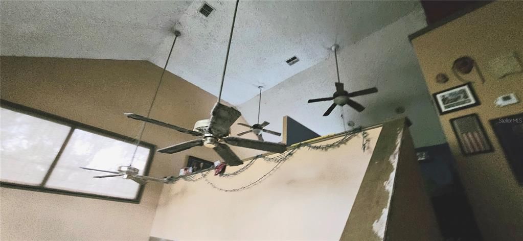 Living room looking up to loft area